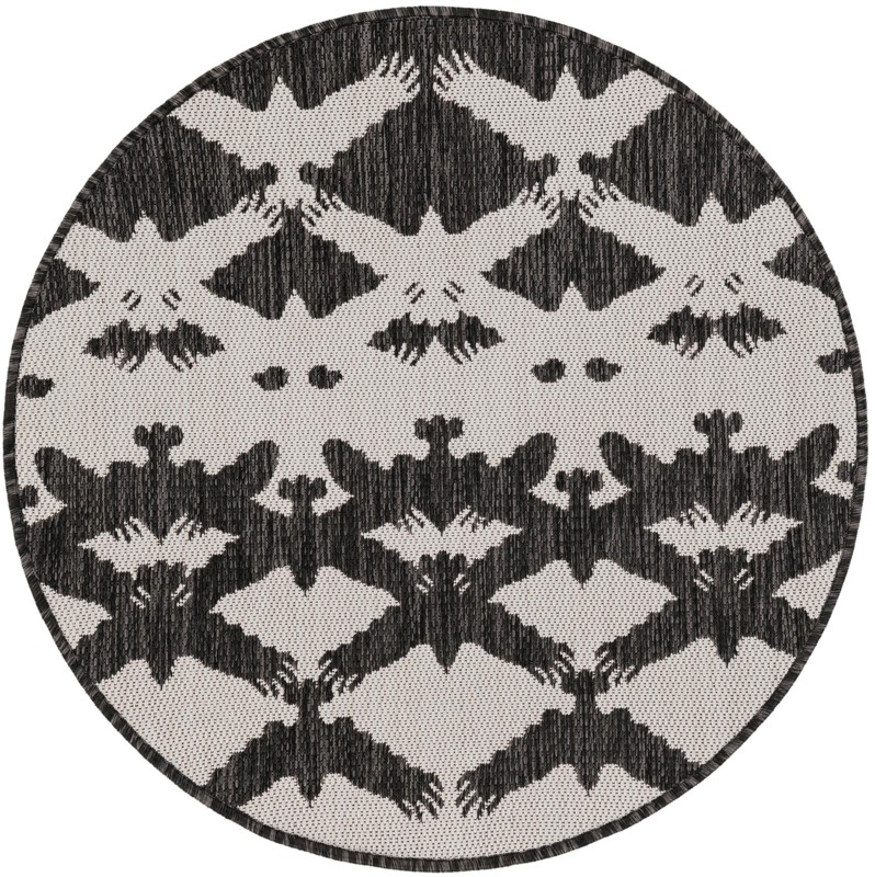 Wayland · Bird tessellation Outdoor Rug, black and white