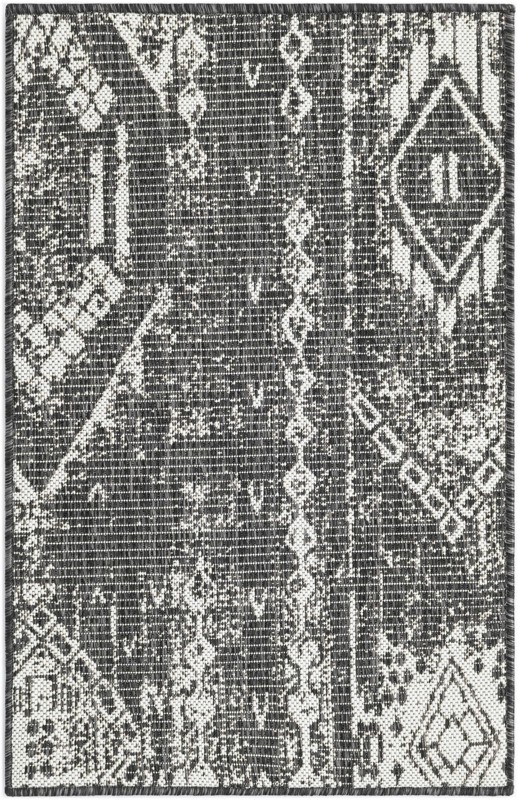 Wildman · Tribal geometric Outdoor Rug, charcoal and ivory