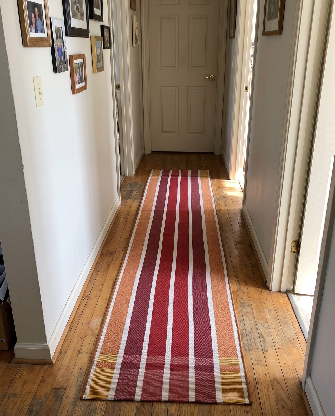 Detail image of 2' 7 x 12' Lomax · Striped Outdoor Rug, coral, peach and ivory