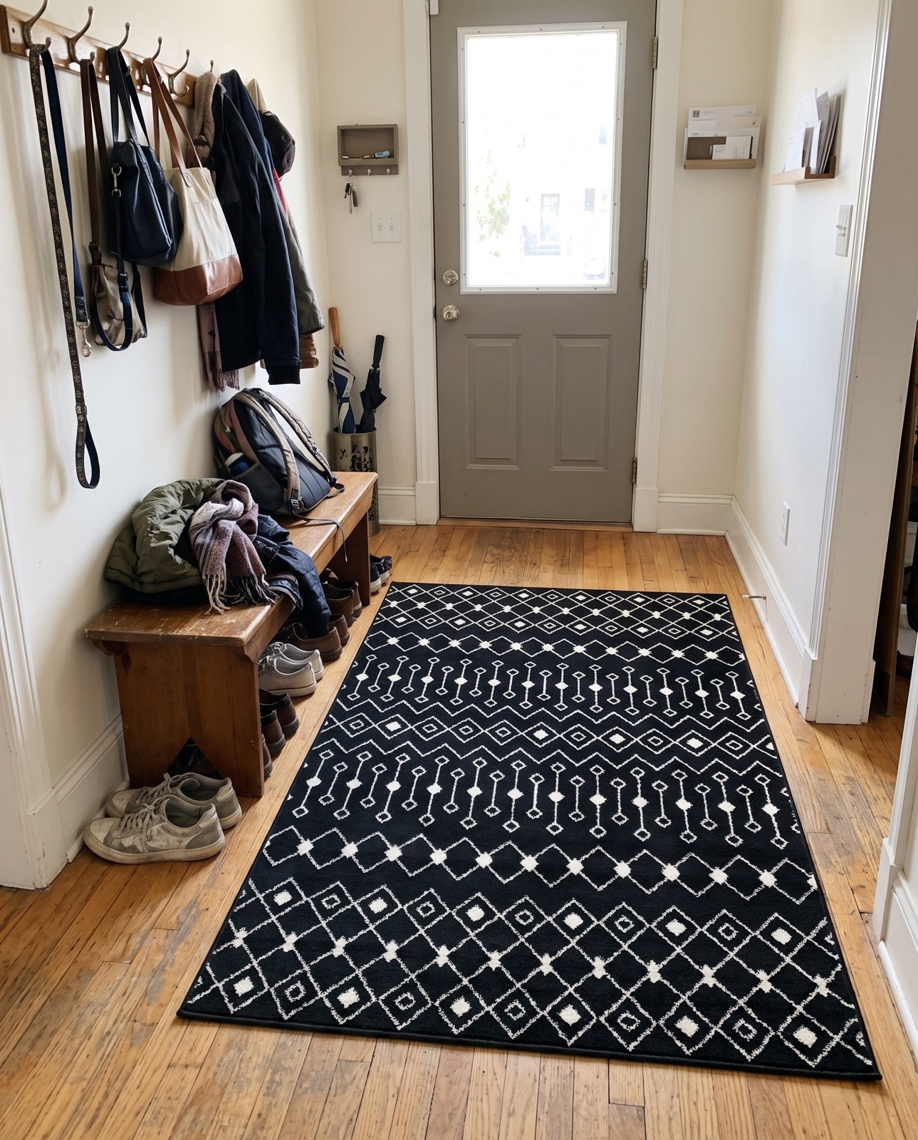 2' x 3' Boswell · Geometric trellis rug, black and white