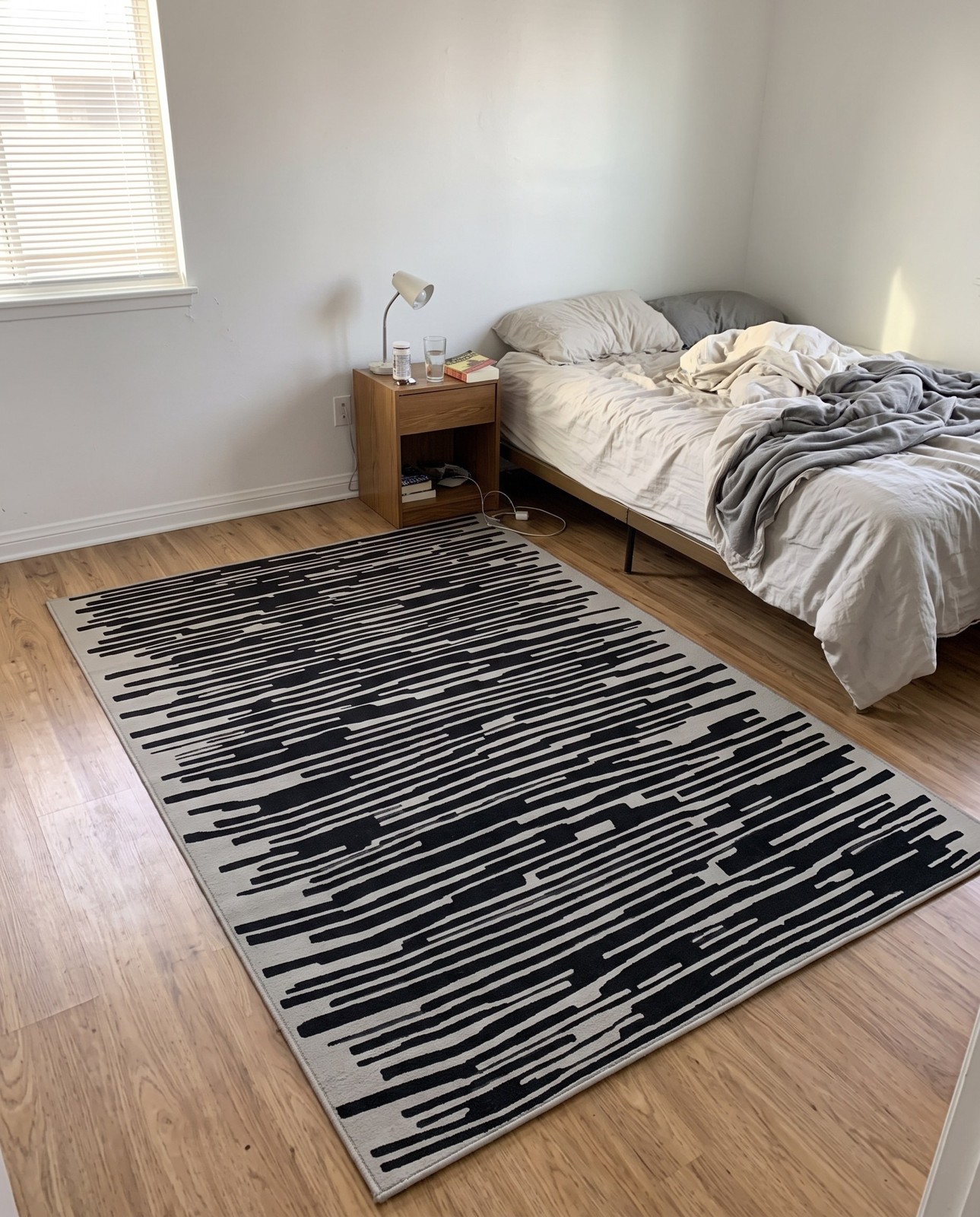 Detail image of 6' x 9' Clemson · Abstract striped rug, black and ivory