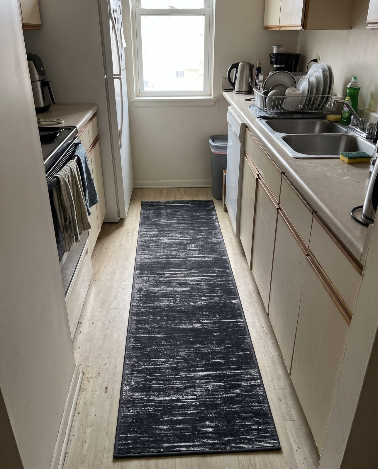 2' 6 x 12' Prewitt · Linear abstract rug, black and ivory