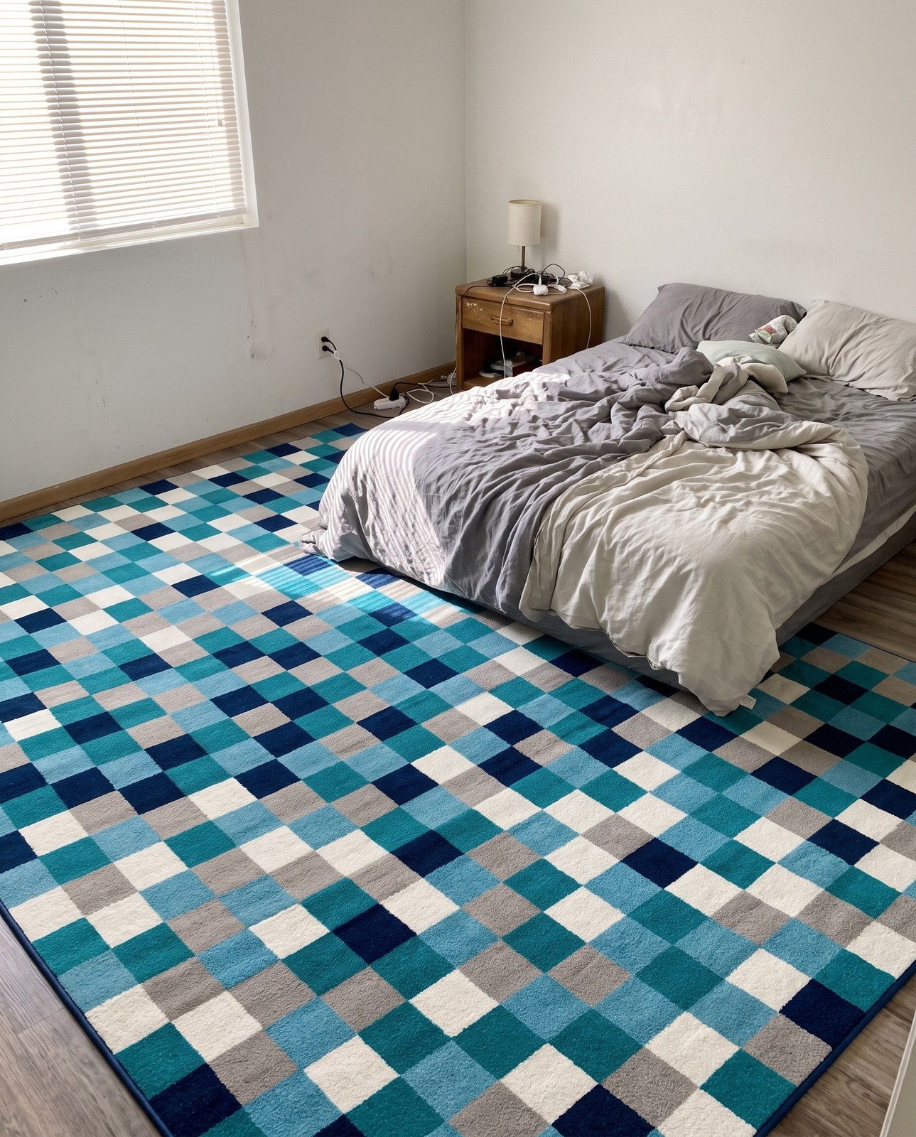 10' x 14' Beasley · Pixel checkered rug, teal and gray