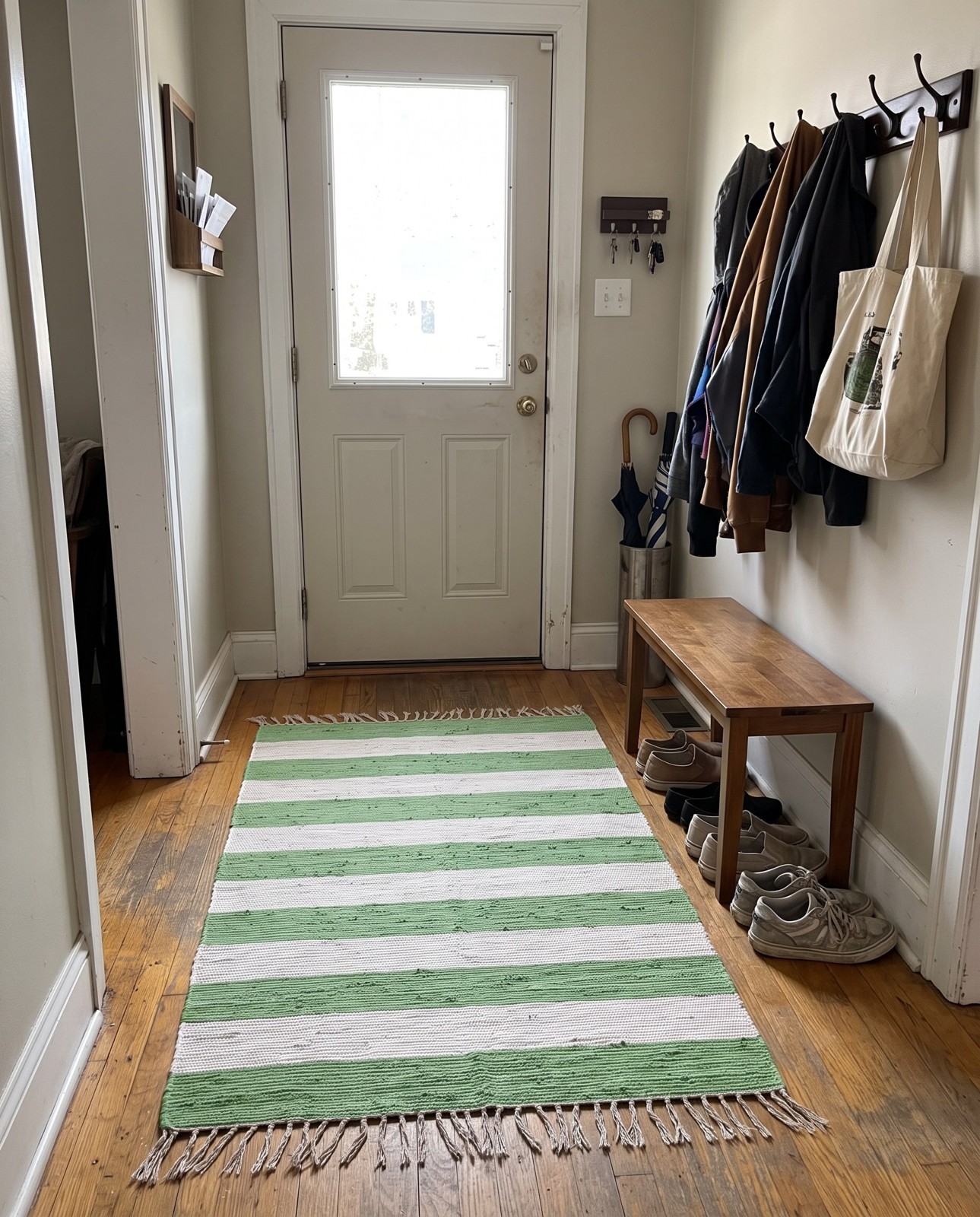 4' 1 x 6' 1 Flagstaff · Striped Chindi Rug, green and ivory