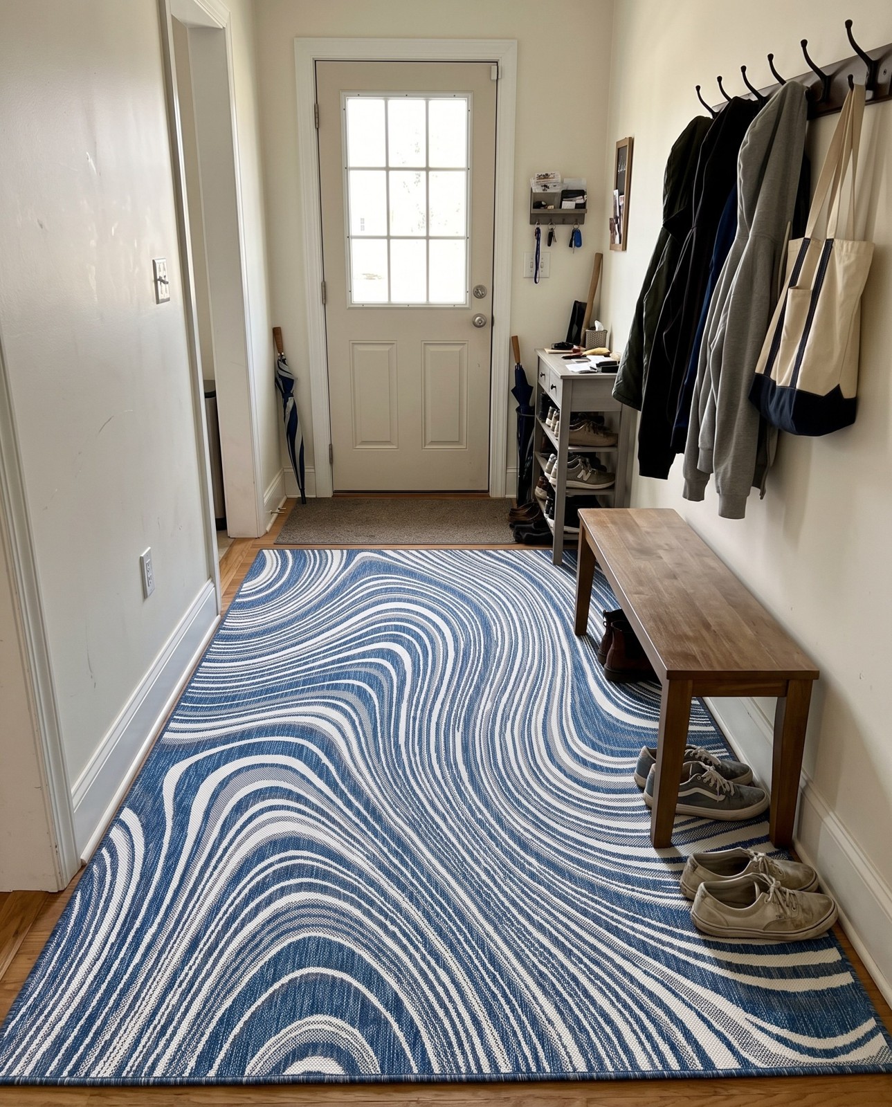 6' x 9' Lander · Abstract wave Outdoor Rug, blue and ivory