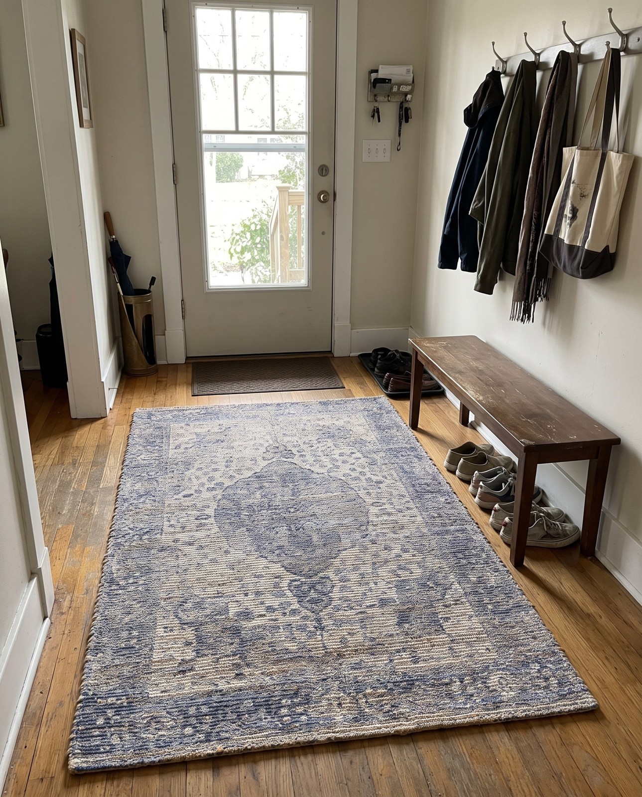 2' x 3' 1 Proctor · Faded medallion rug, blue and ivory