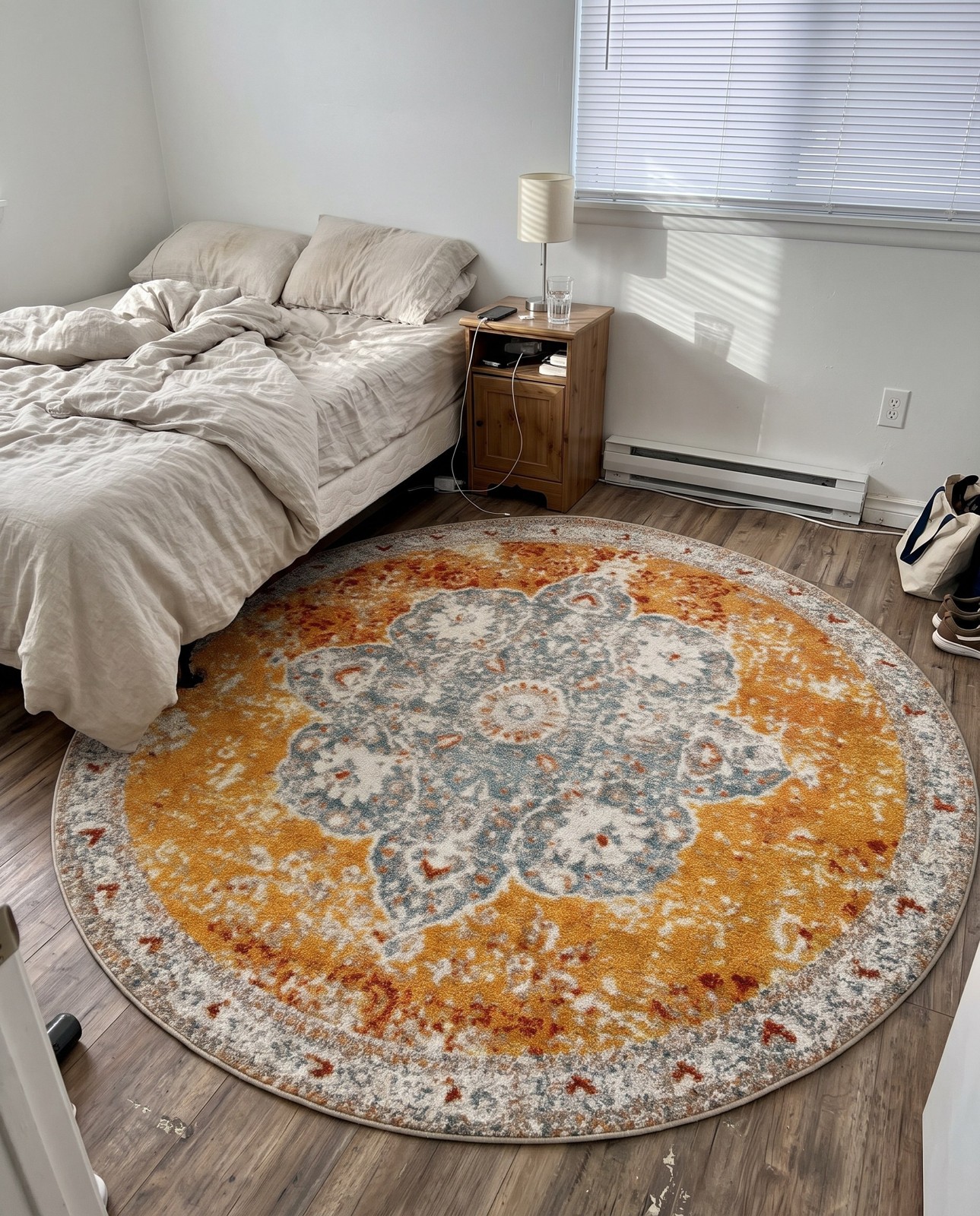 8' x 8' Bonham · Medallion rug, orange and blue