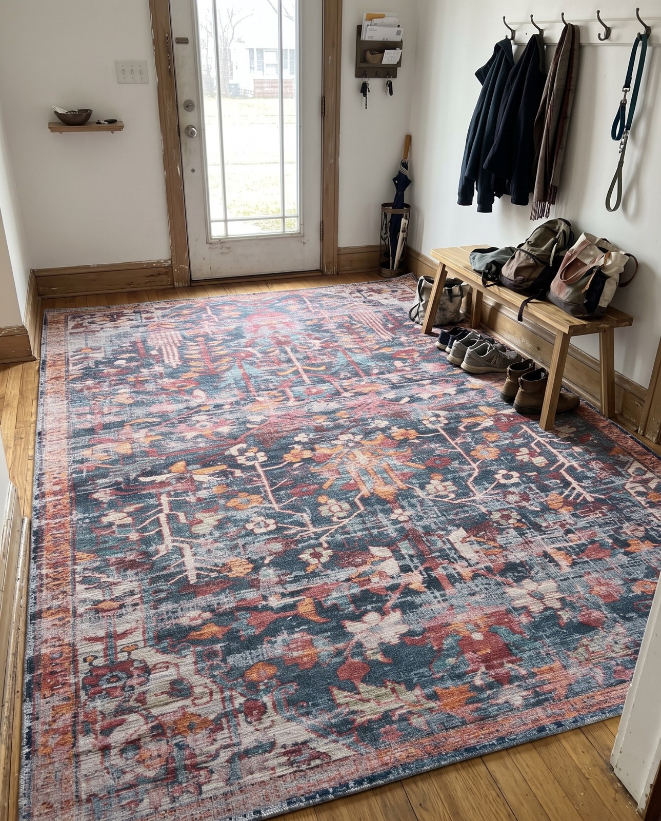 10' 6 x 13' Massey · Distressed floral Washable Rug, navy and rust