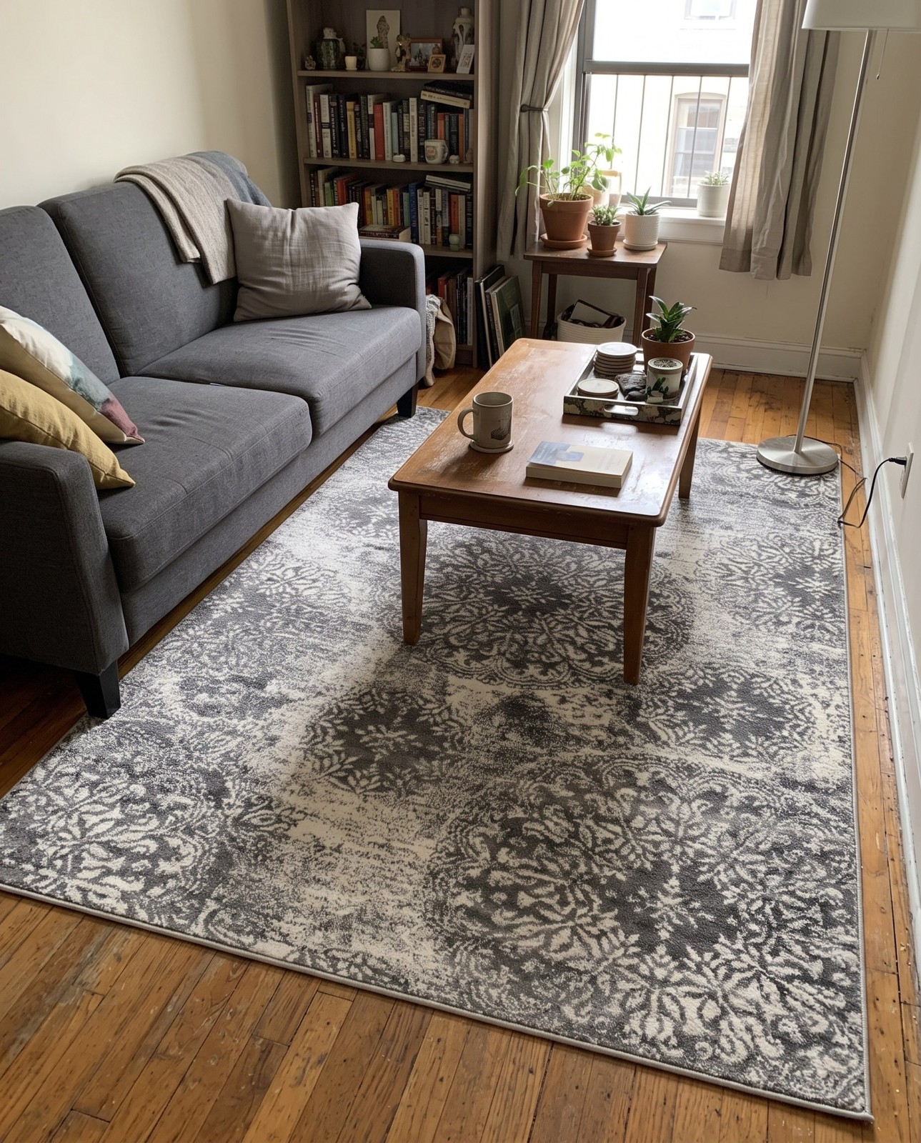 7' x 10' Blakemore · Distressed medallion rug, gray and ivory
