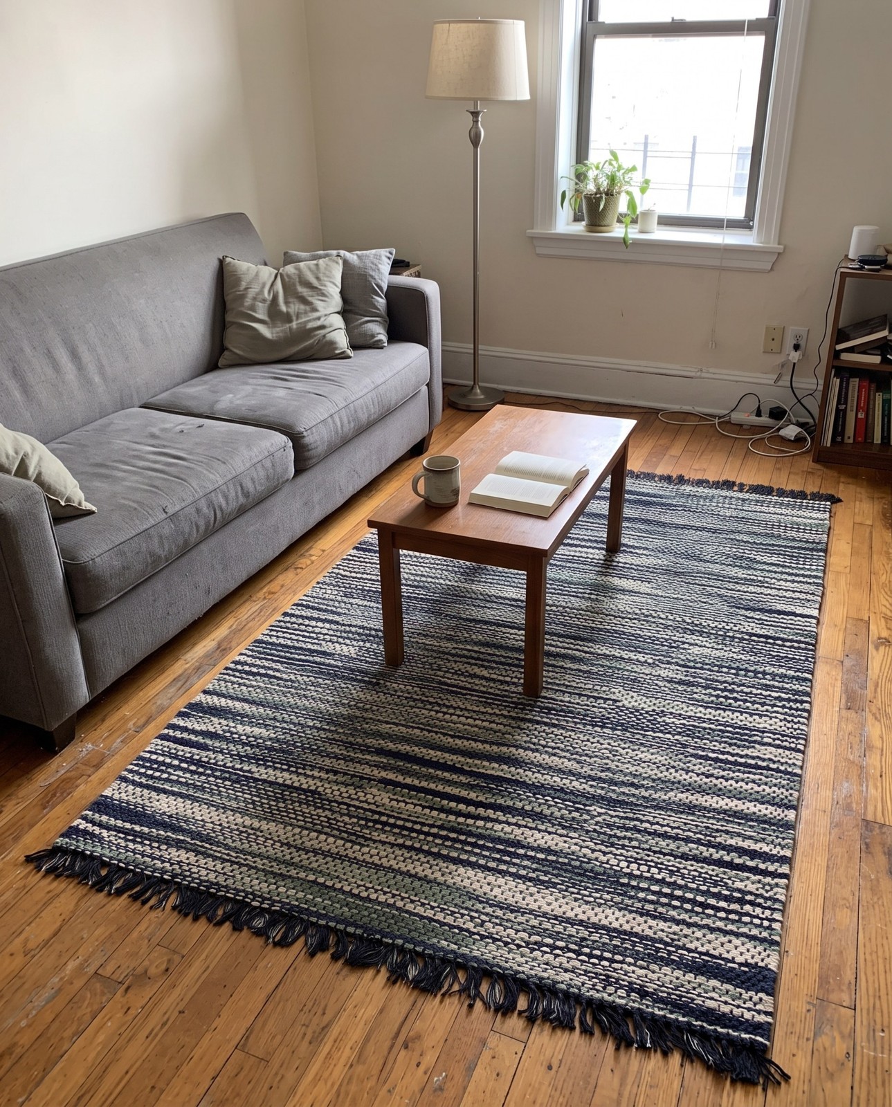 Detail image of 4' 1 x 6' 1 Barrett · Lines rug, green and ivory