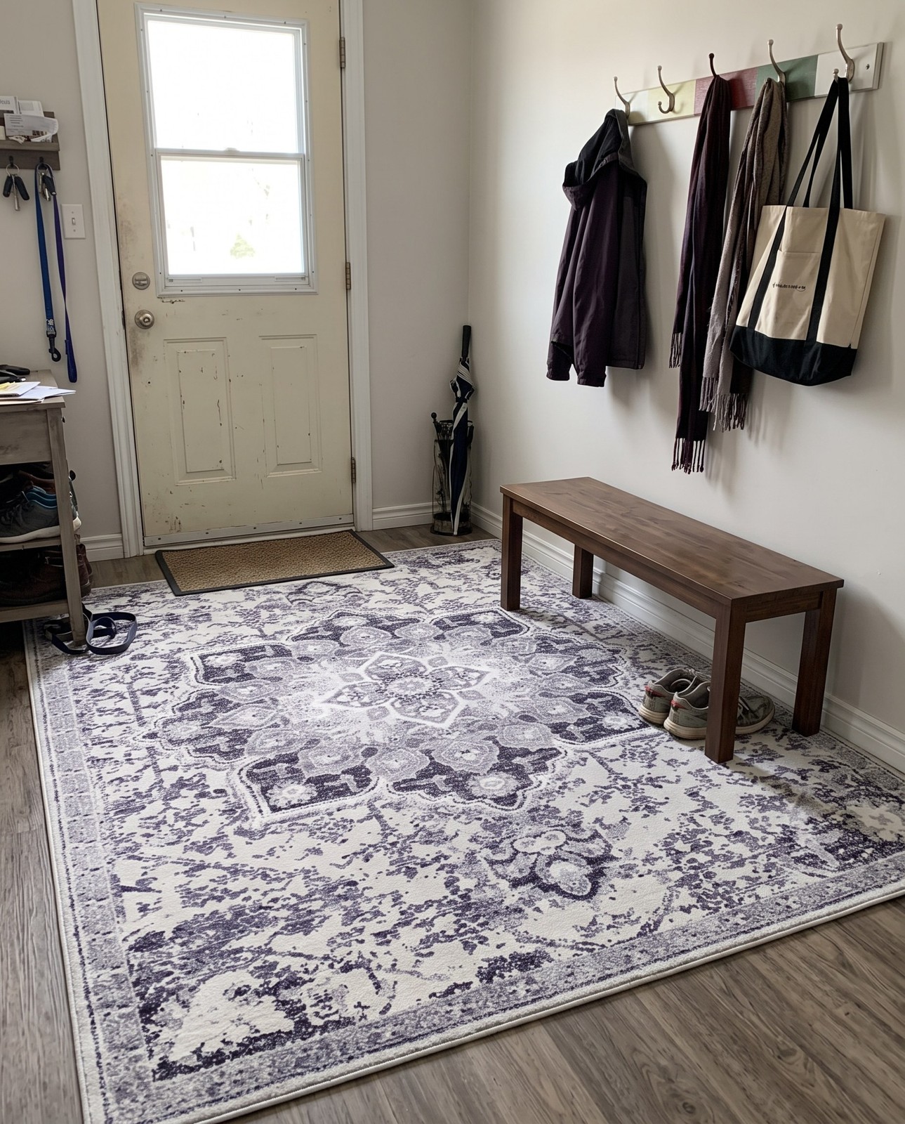 10' 6 x 13' Rideout · Distressed medallion Washable Rug, gray and ivory