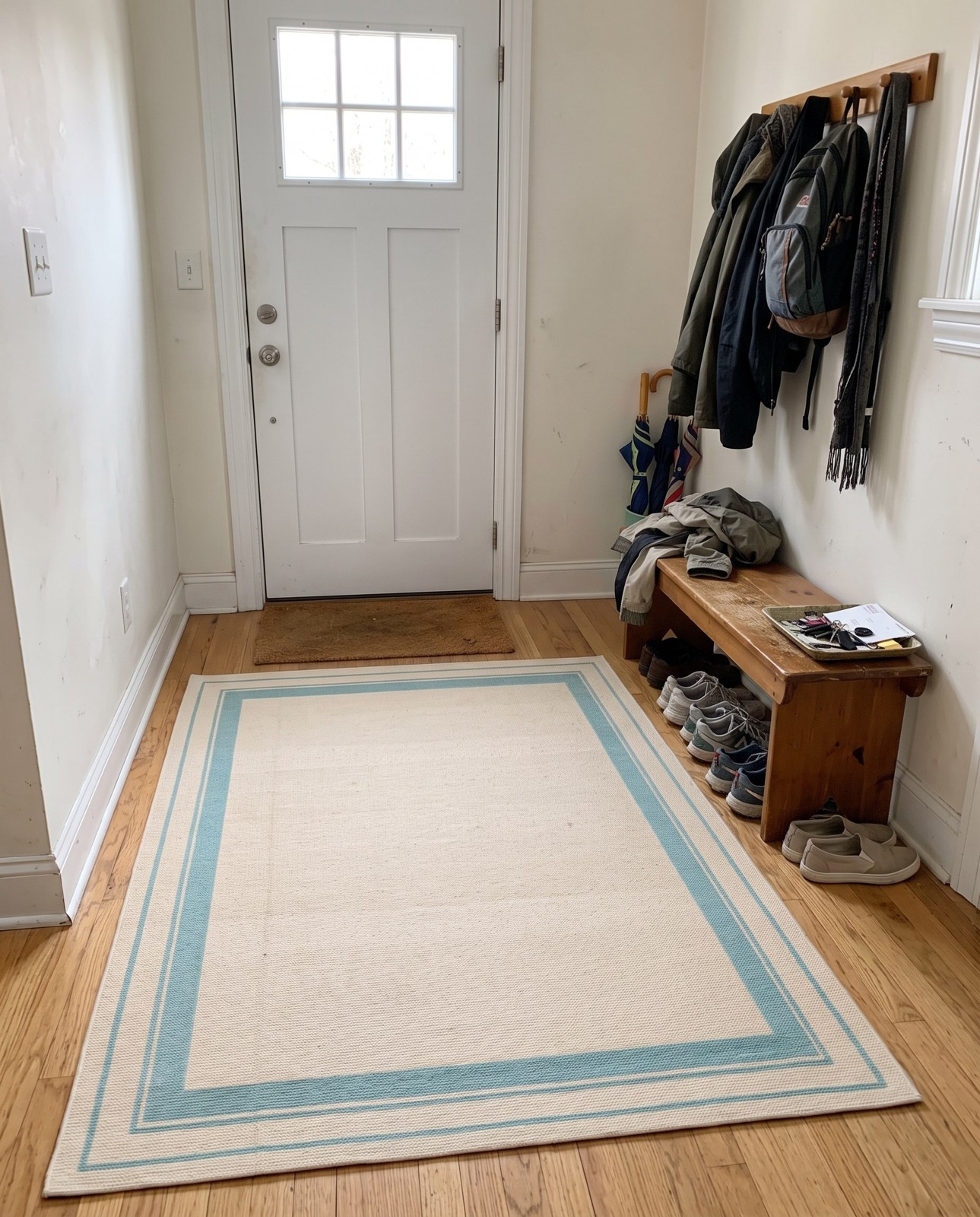 5' 3 x 7' 7 Easton · Border Outdoor Rug, tan and light blue