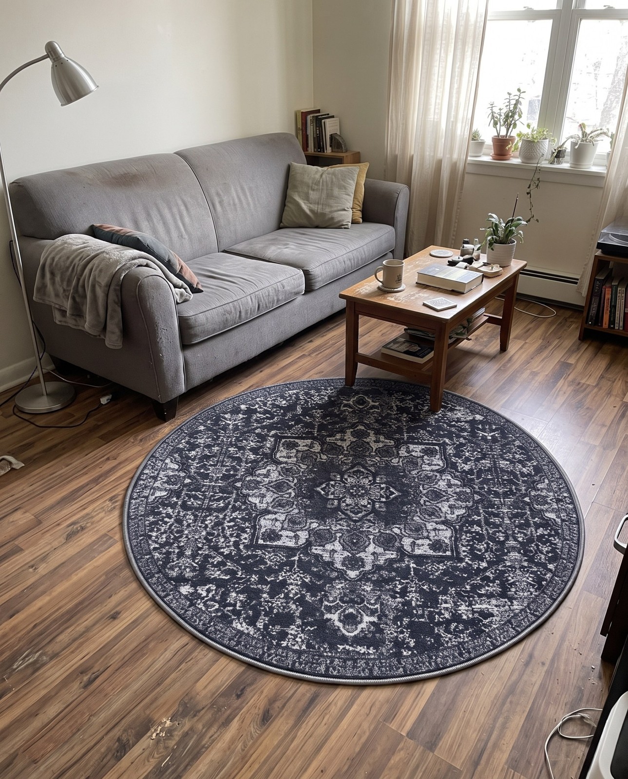 5' x 7' Rideout · Distressed medallion rug, charcoal and gray