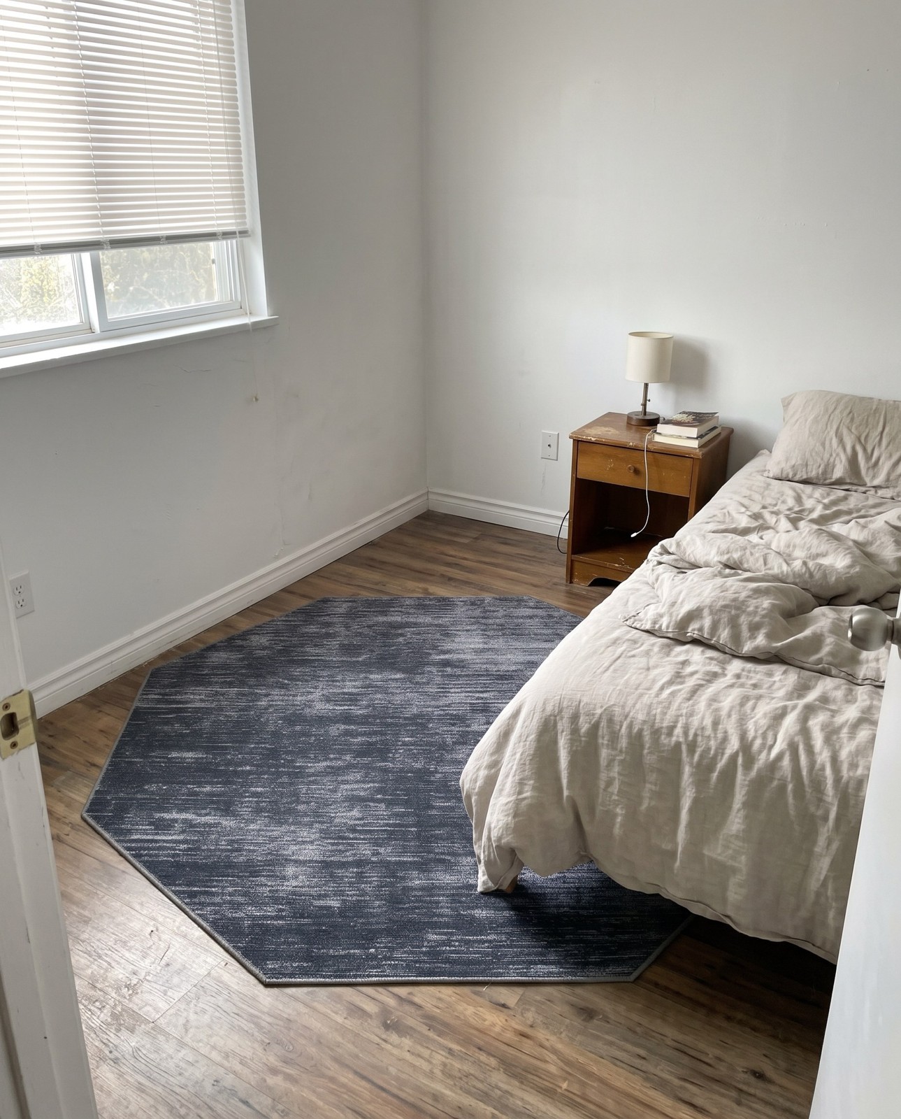 Detail image of 5' x 5' Prewitt · Linear abstract rug, black and ivory