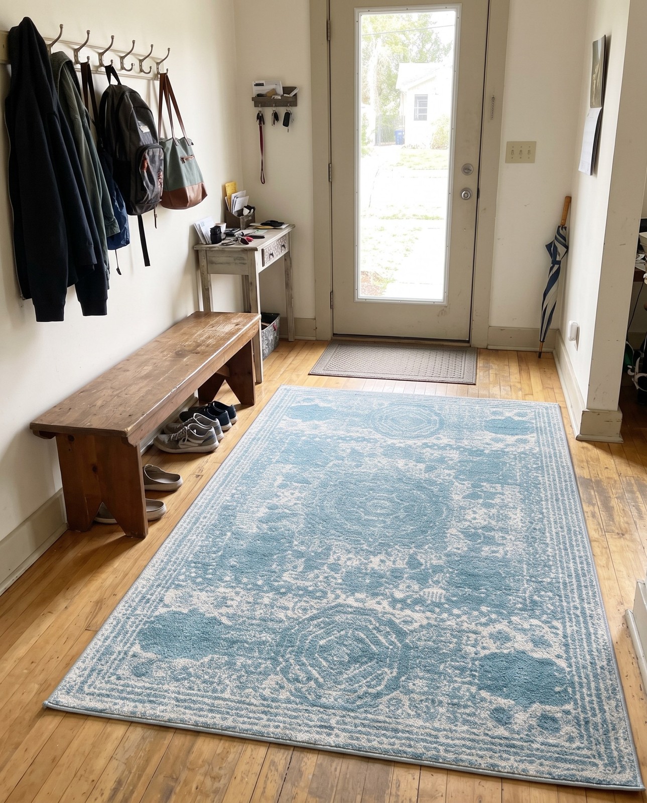6' x 9' Benedict · Distressed medallion rug, aqua and ivory