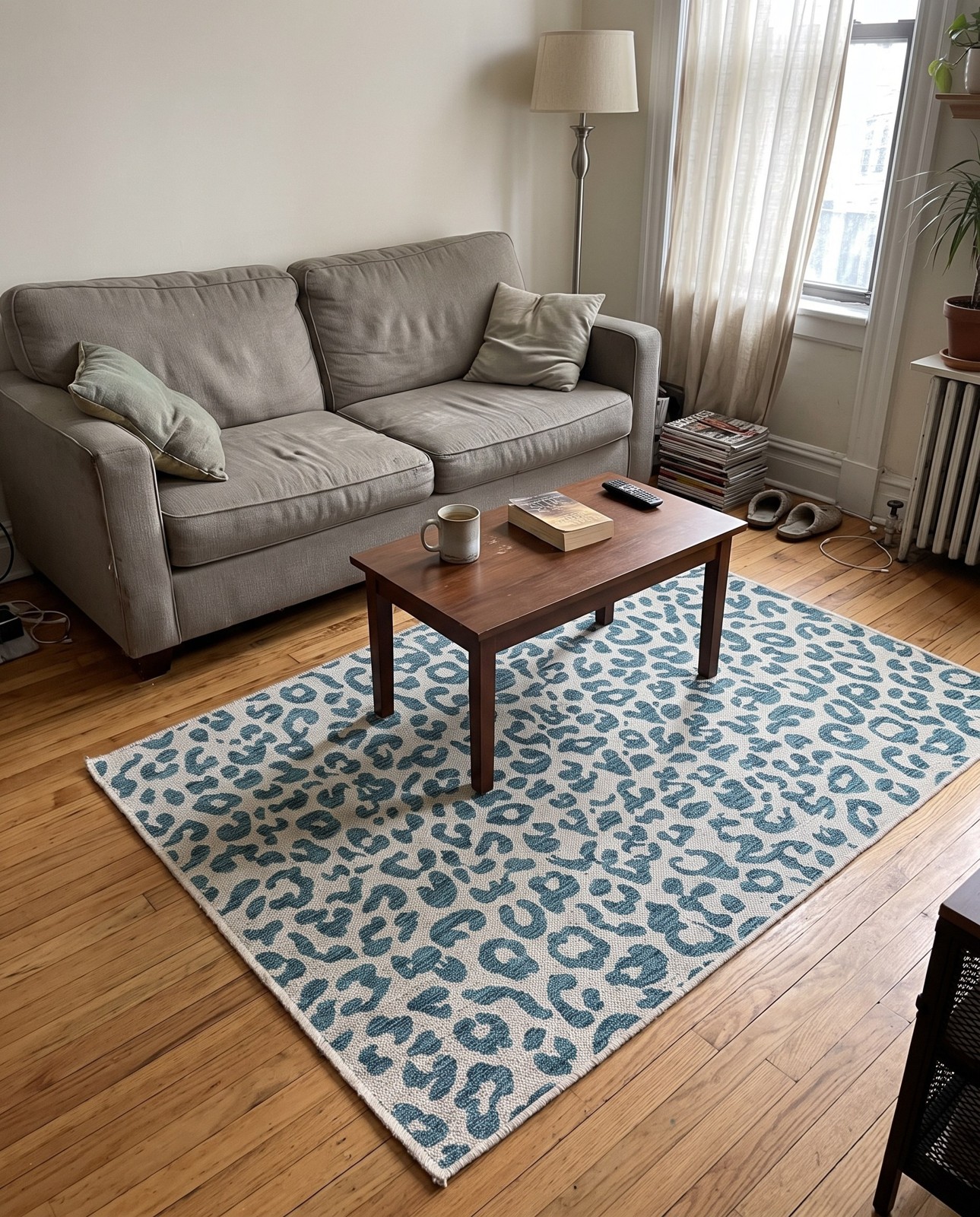 Detail image of 9' x 12' Cardamom · Leopard print Outdoor Rug, teal and ivory