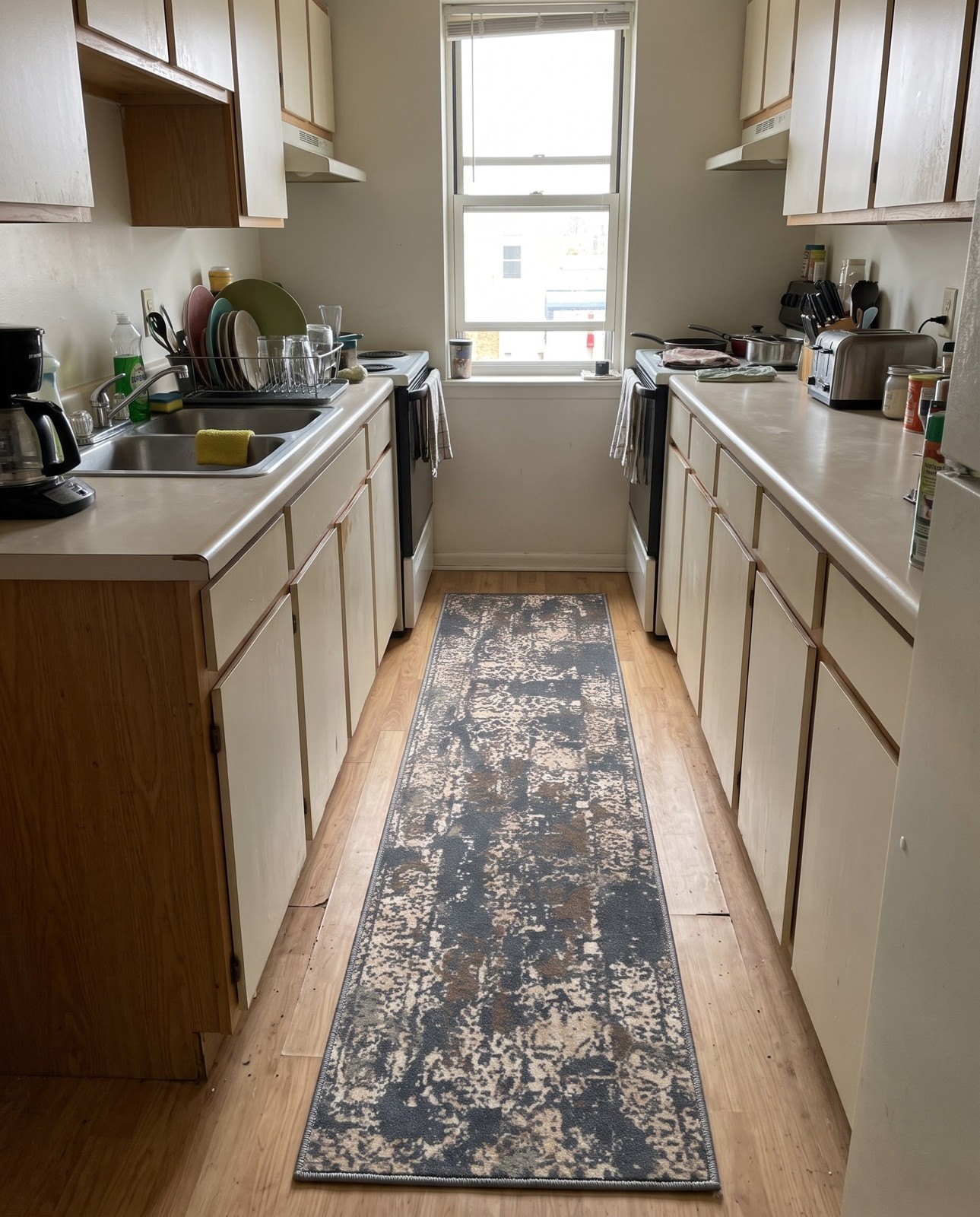 2' x 6' Maude · Distressed medallion rug, gray and beige