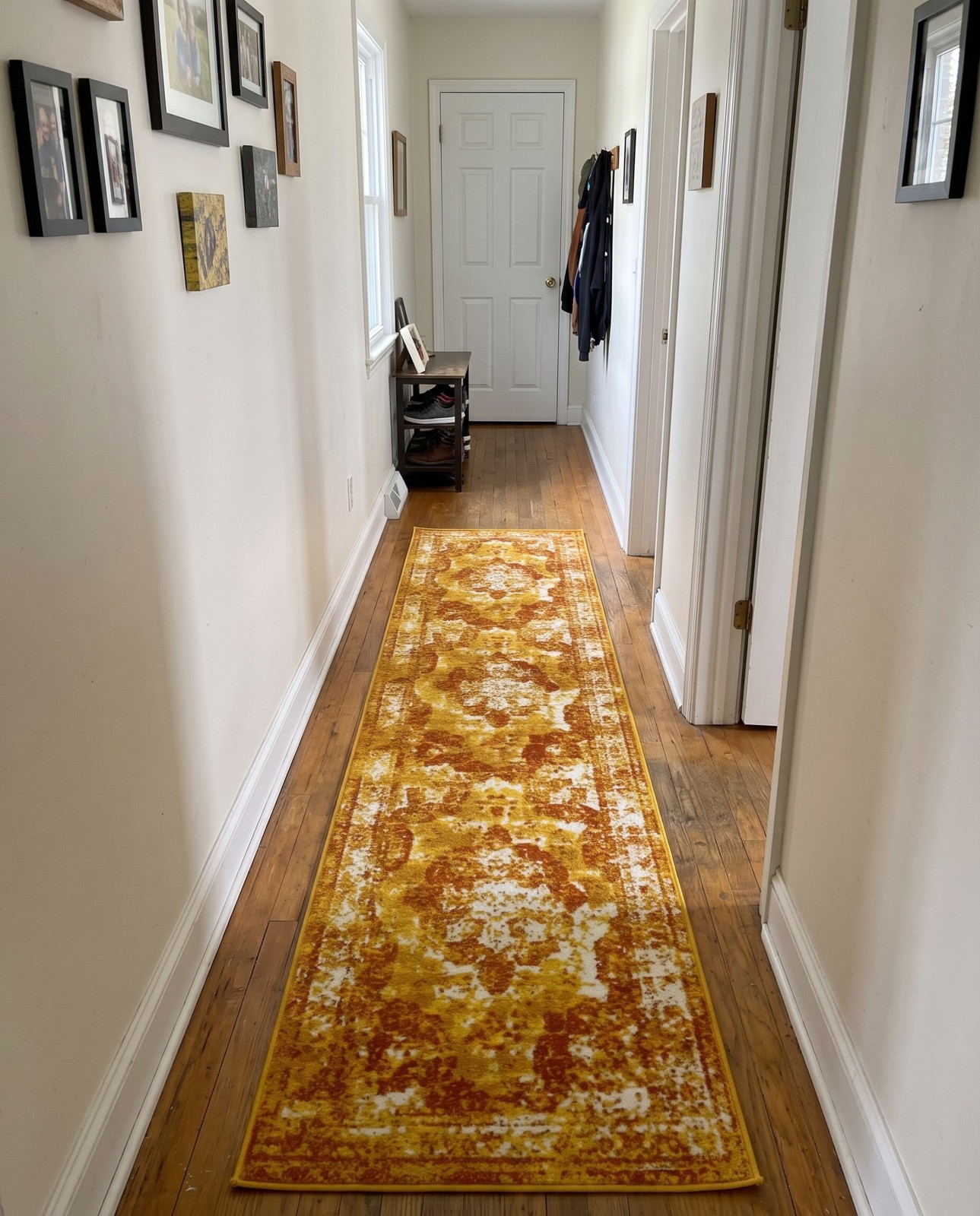 2' x 13' Blakemore · Distressed medallion rug, orange and ivory
