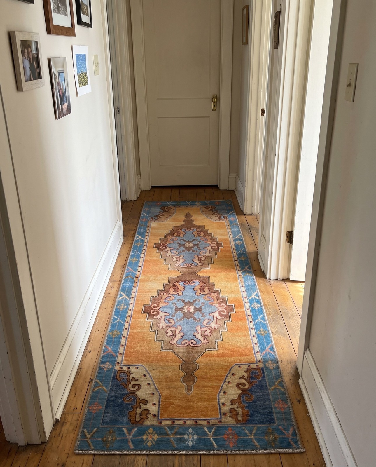 Detail image of 2' x 4' Sanderson · Medallion Washable Rug, orange and blue