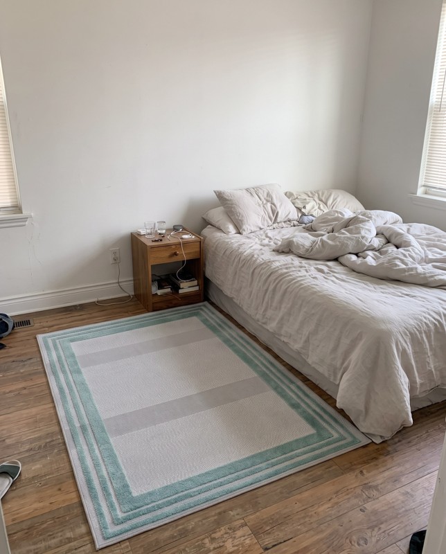 Walnut Border rug, gray and teal, 4×6, in a room