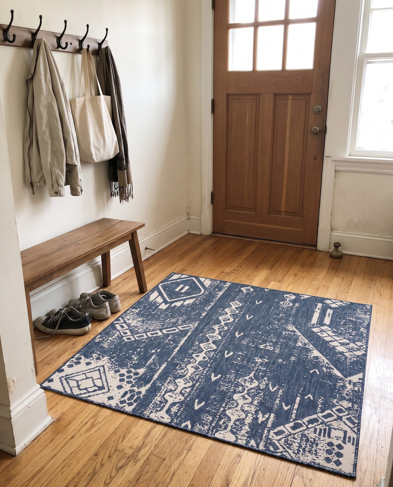 Detail image of 13' x 13' Wildman · Tribal geometric Outdoor Rug, blue and ivory