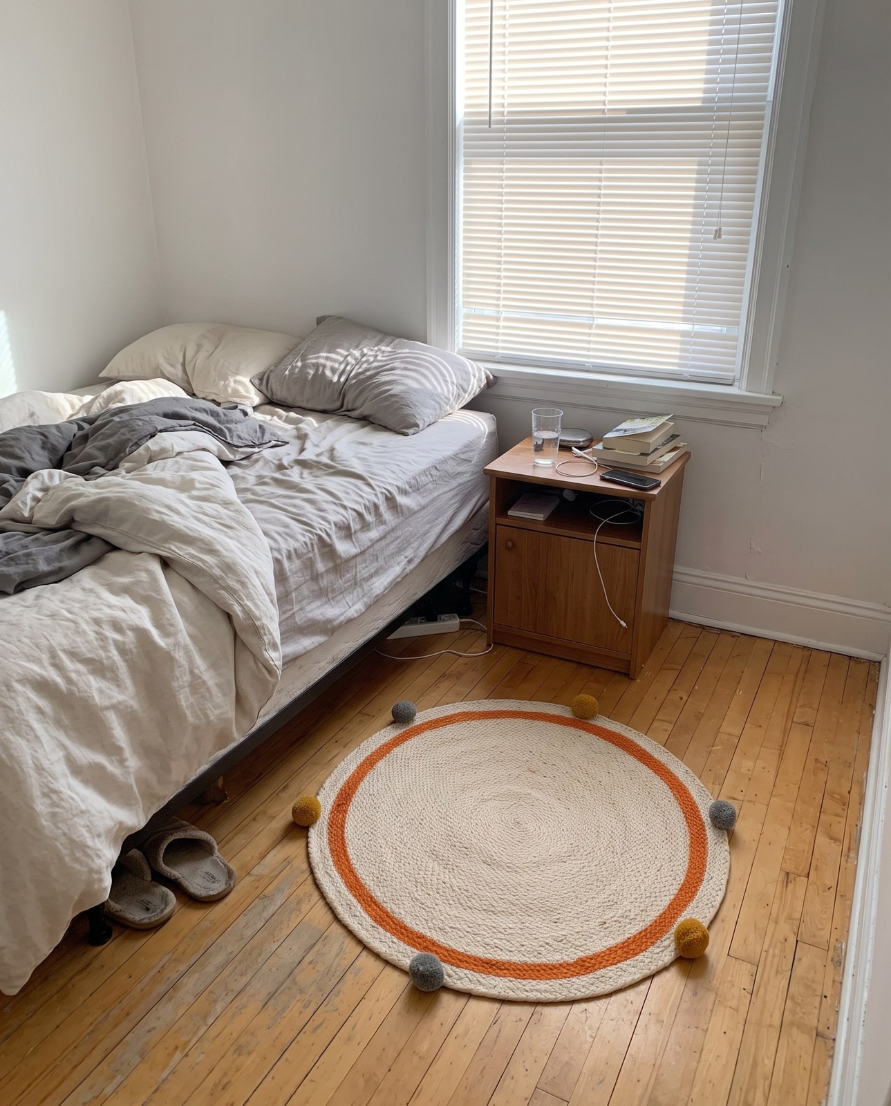 Detail image of 2' x 3' 1 Godwin · Border Wool Braided Jute Rug, white, orange and gray