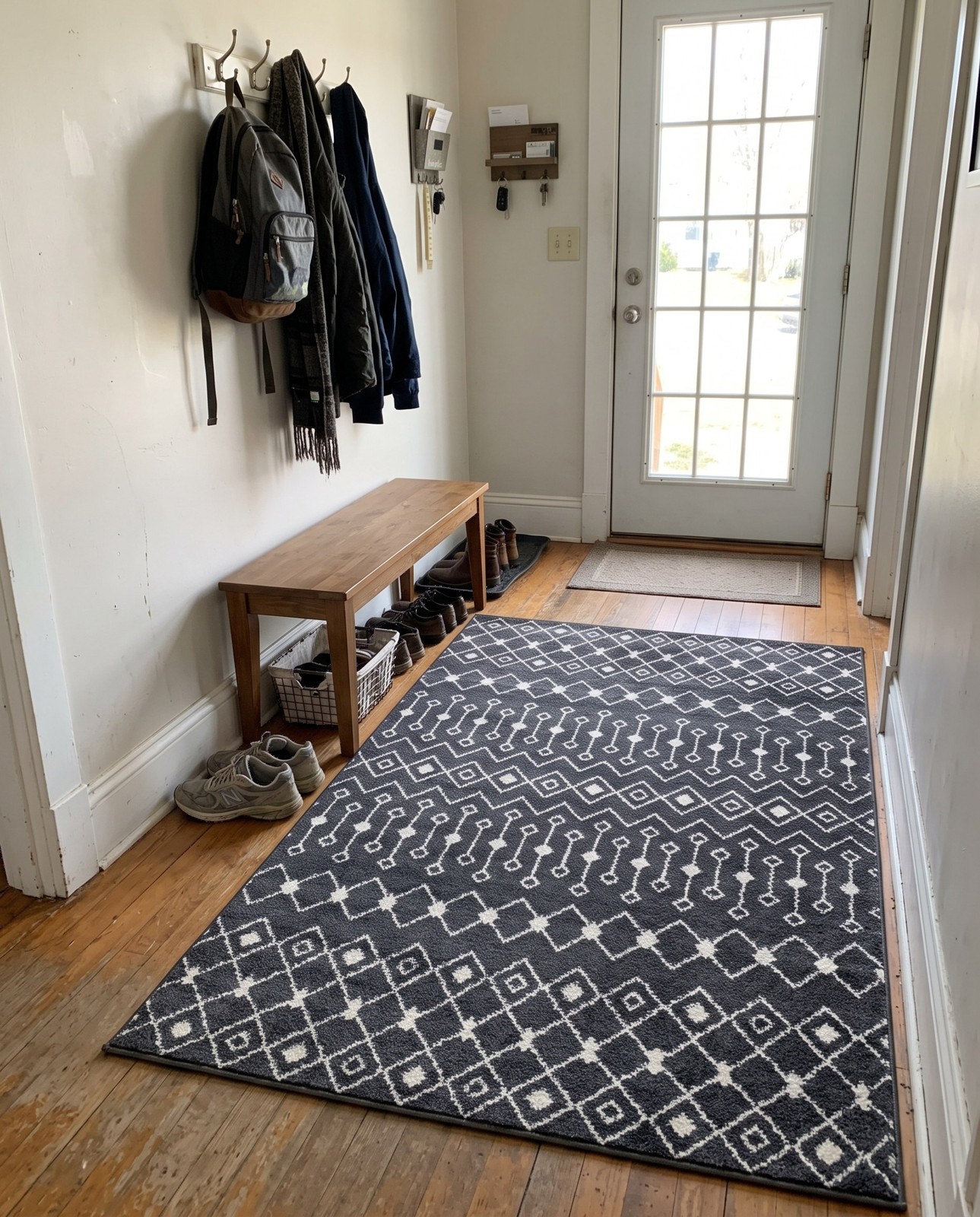 9' x 12' Boswell · Geometric tribal rug, dark gray and ivory