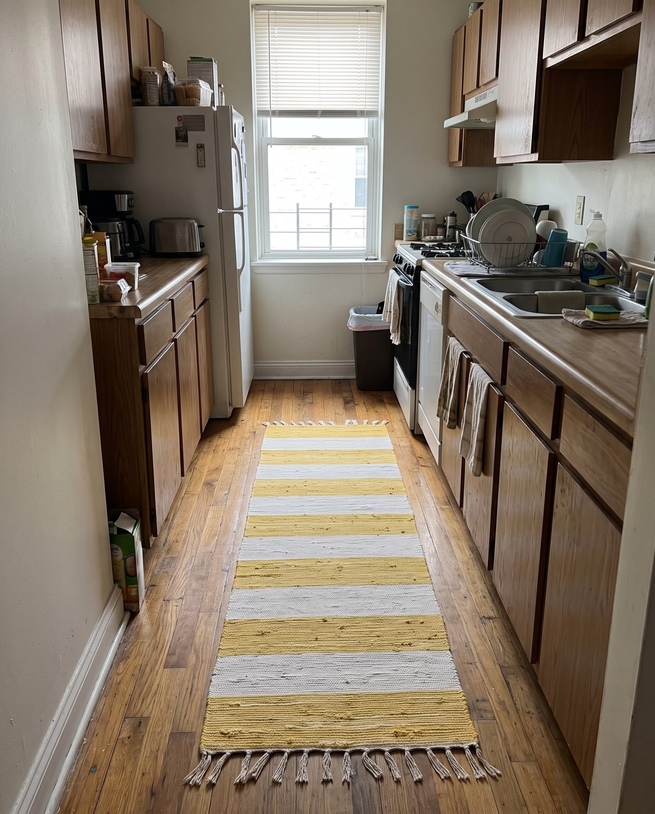 Detail image of 2' 7 x 12' Flagstaff · Striped Chindi Rug, yellow and ivory