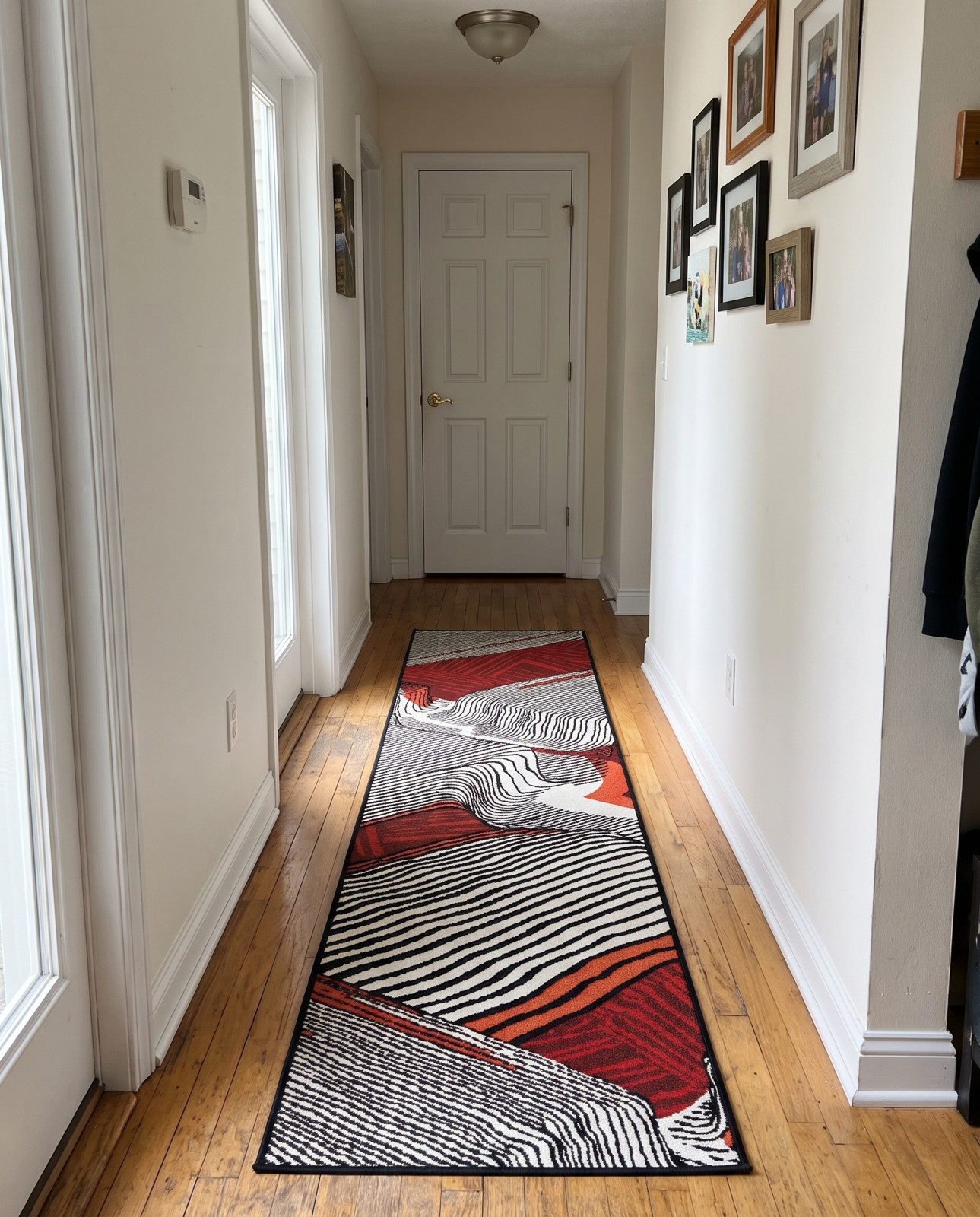 Detail image of 2' x 8' Orchard · Abstract striped Outdoor Rug, red and black
