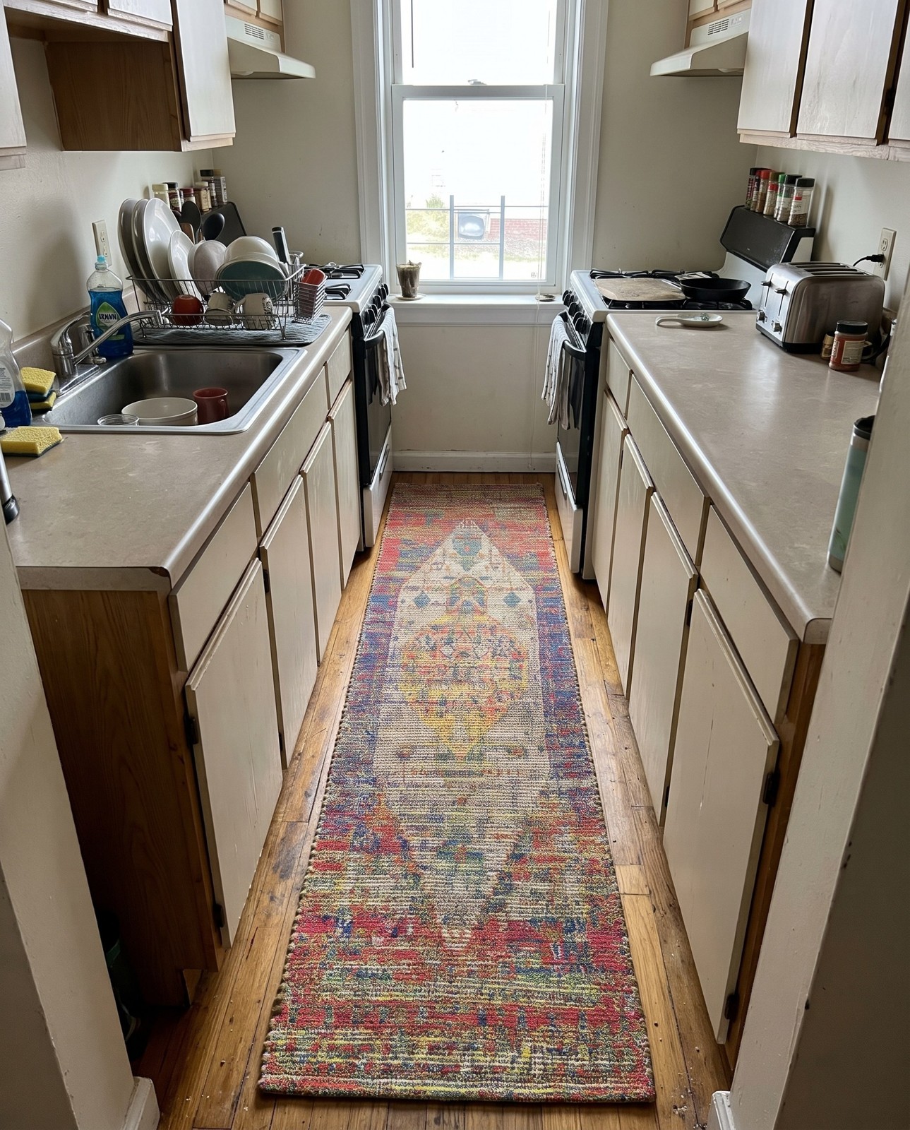Detail image of 2' 2 x 8' Milford · Distressed medallion rug, multicolor
