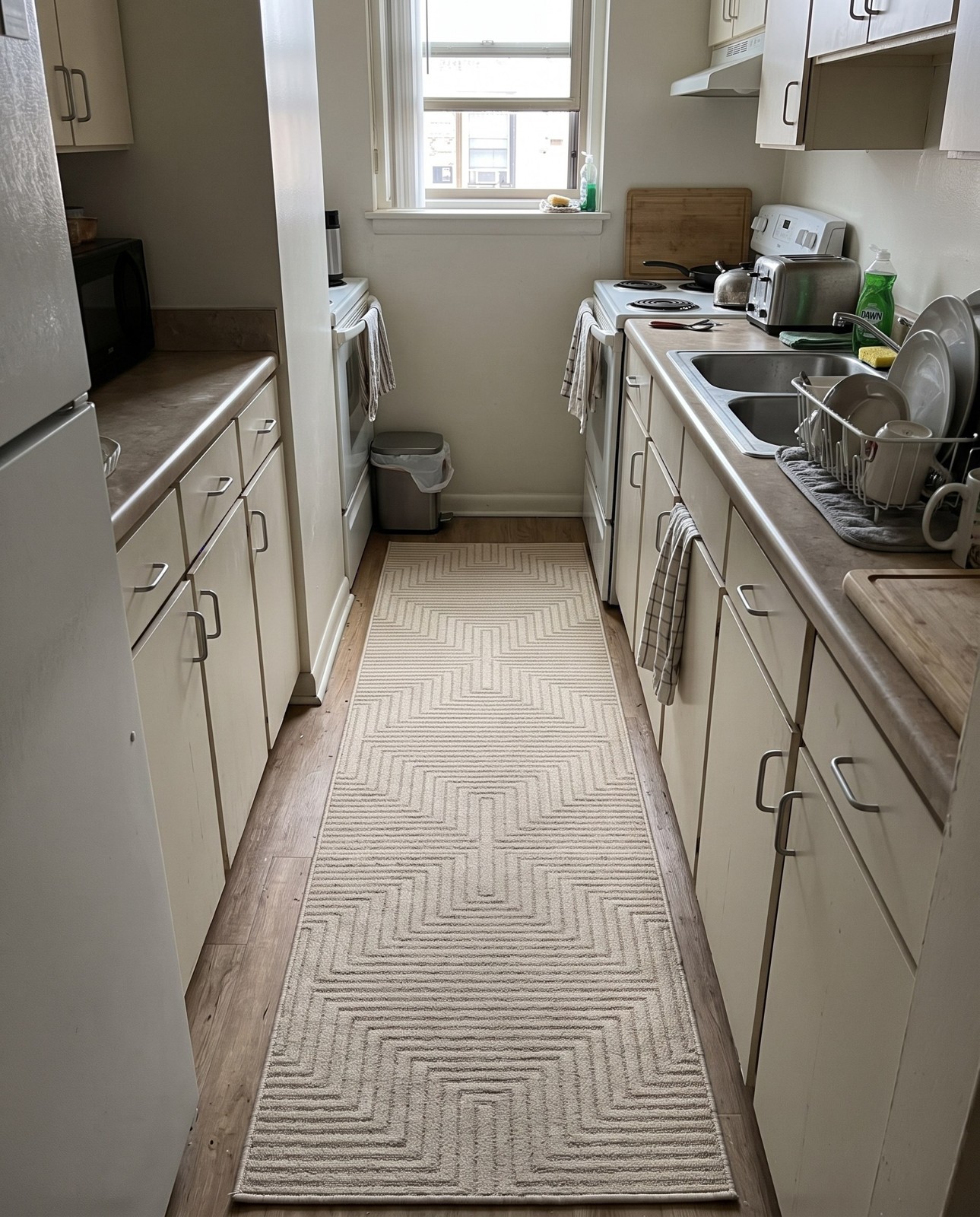 2' x 3' Osprey · Geometric labyrinth rug, ivory and beige