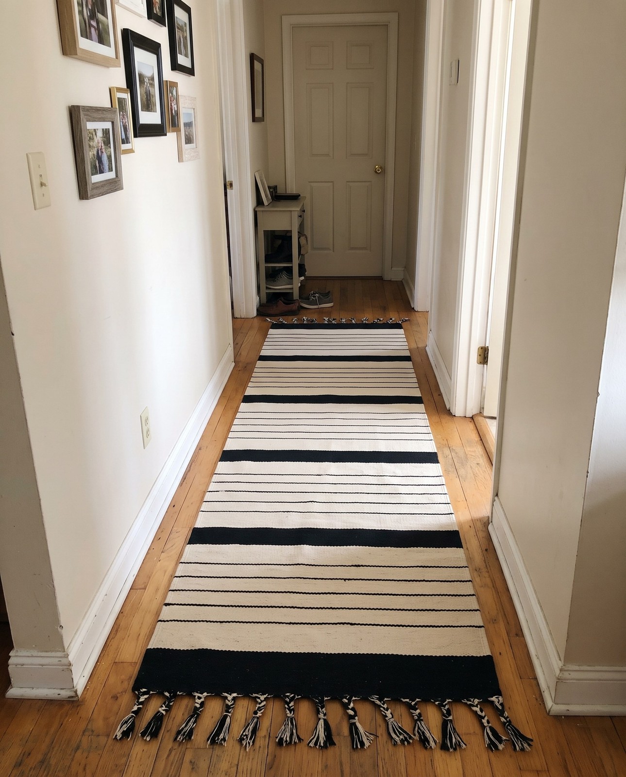 2' 7 x 10' Ottley · Striped Chindi Rug, black and white